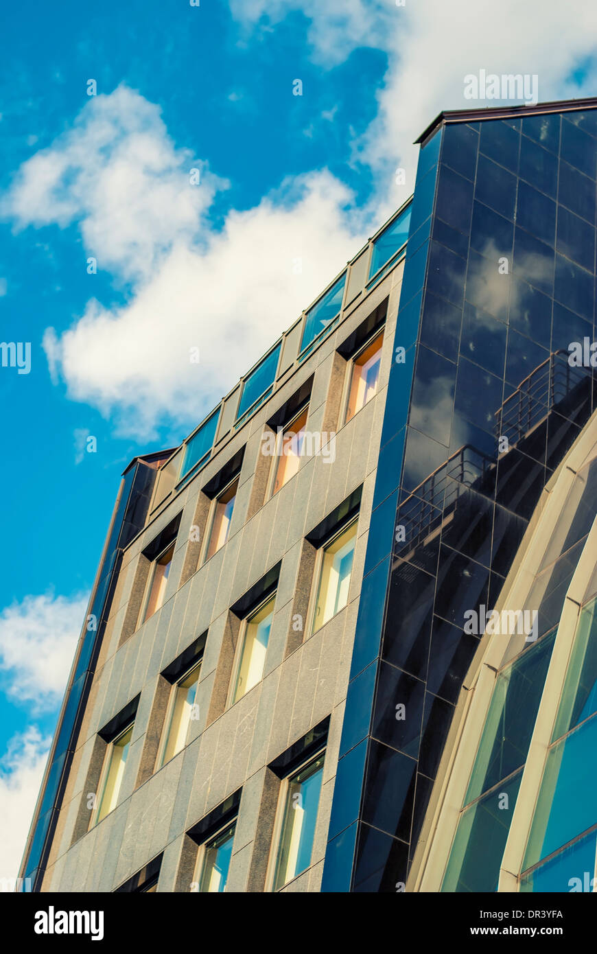 futuristic building with mirrored facade in blue Stock Photo