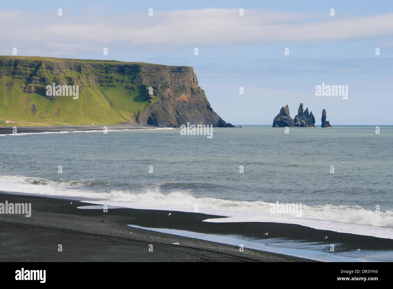 Mount Reynir and rock formations of Reynisdrangar from the Dyrholaey promontory in the southern coast of Iceland. Stock Photo