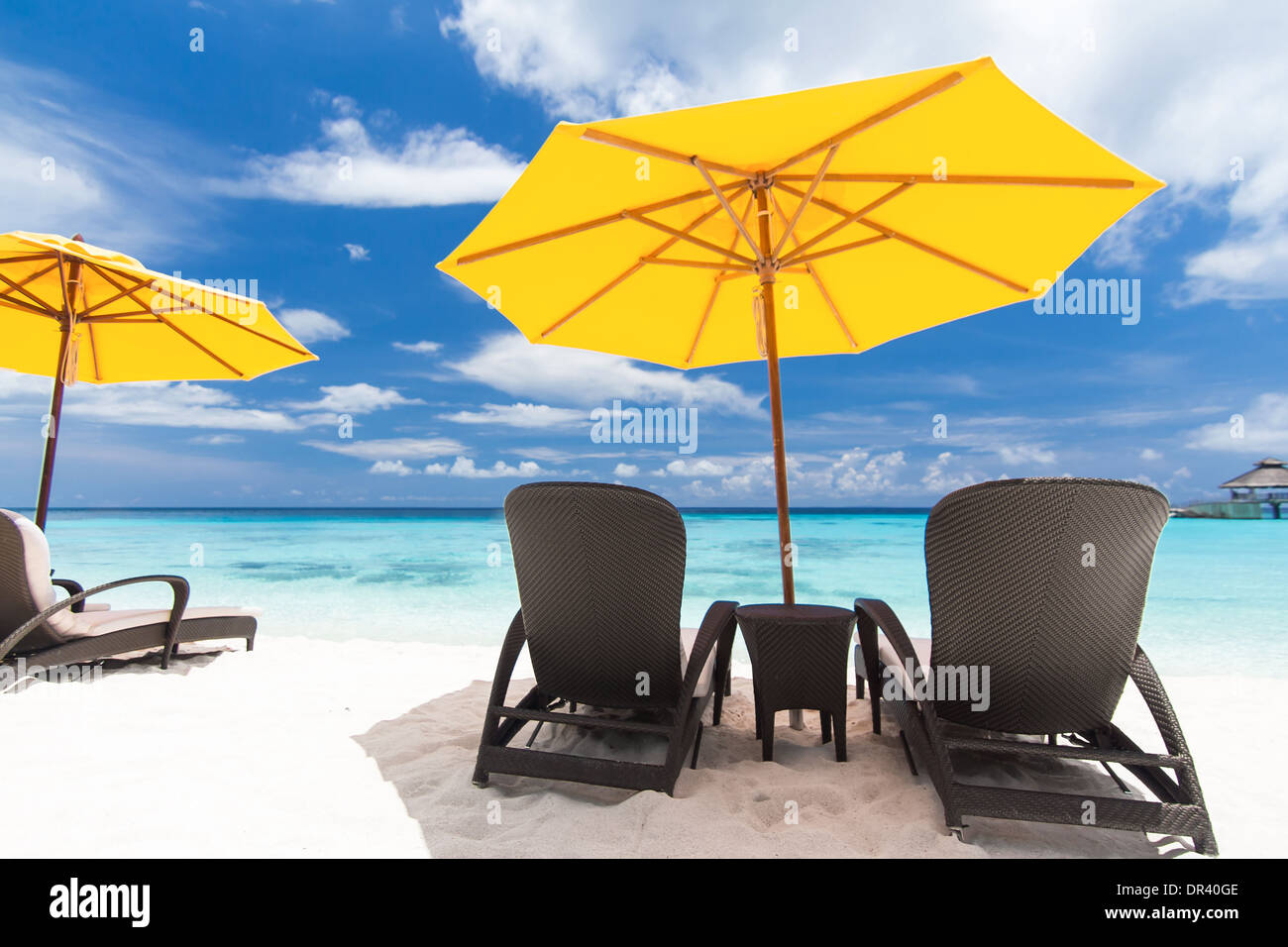 Sun umbrellas and chairs on beach Stock Photo Alamy
