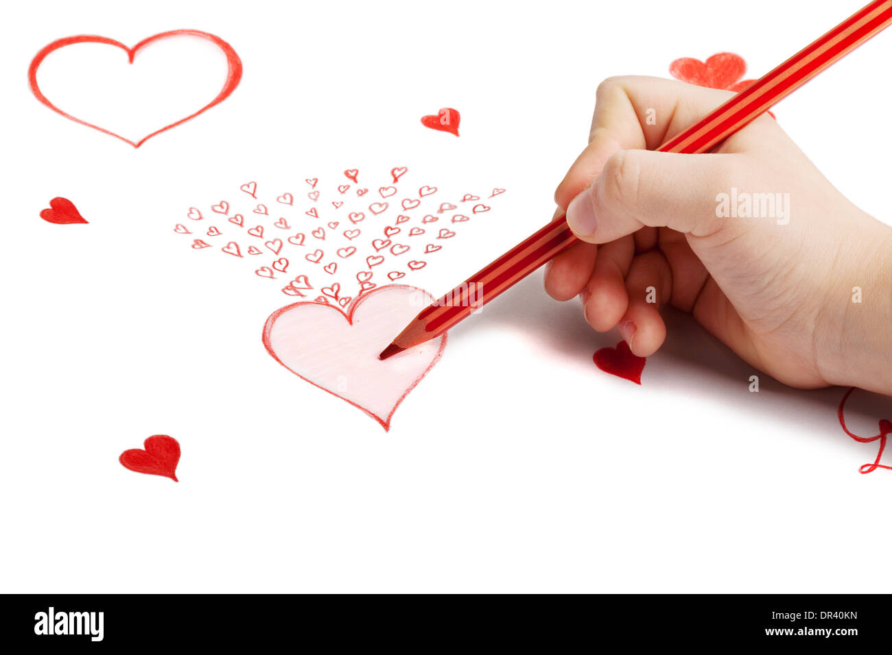 Child's hand drawing Saint Valentine card with hearts Stock Photo