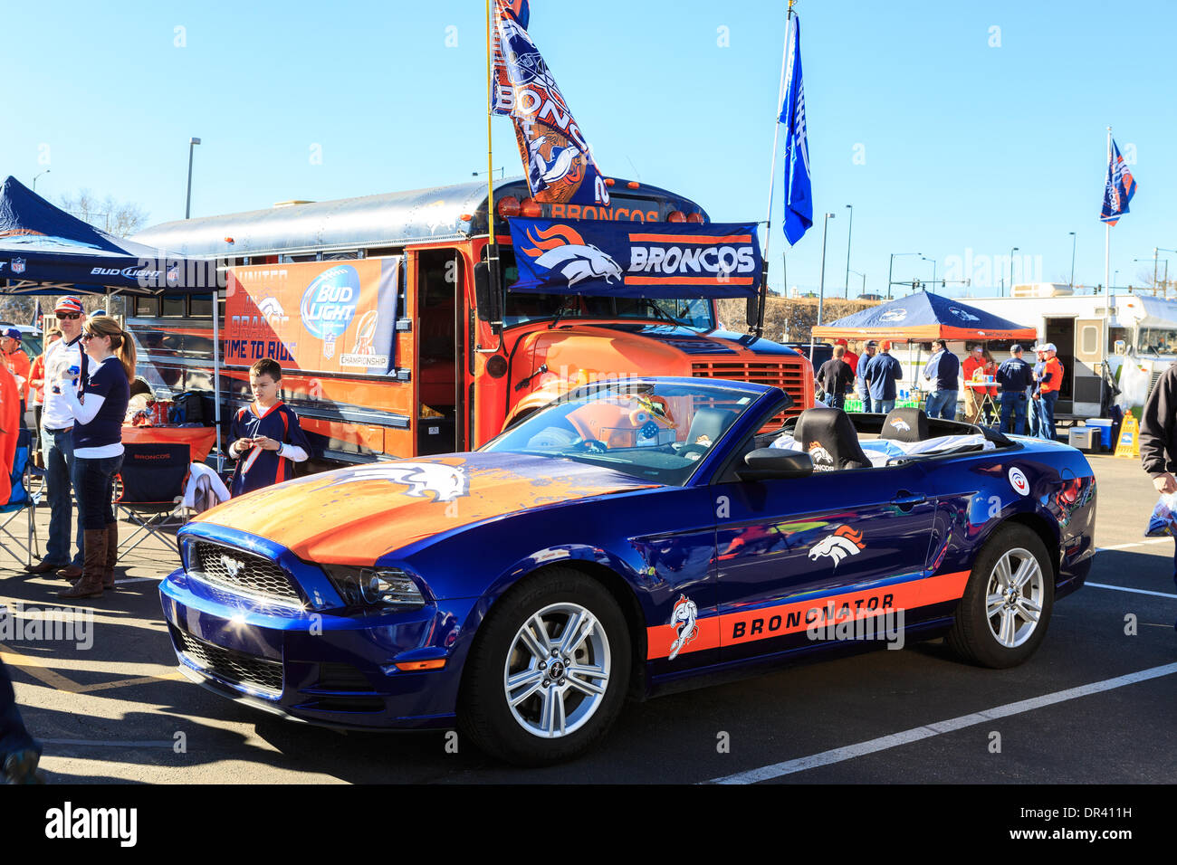 Denver, Colorado USA – 19 January 2014.  Football fans tailgate in the parking lot of Sports Authority Field at Mile High before the AFC playoff game between the Denver Broncos and New England Patriots. Credit:  Ed Endicott/Alamy Live News Stock Photo