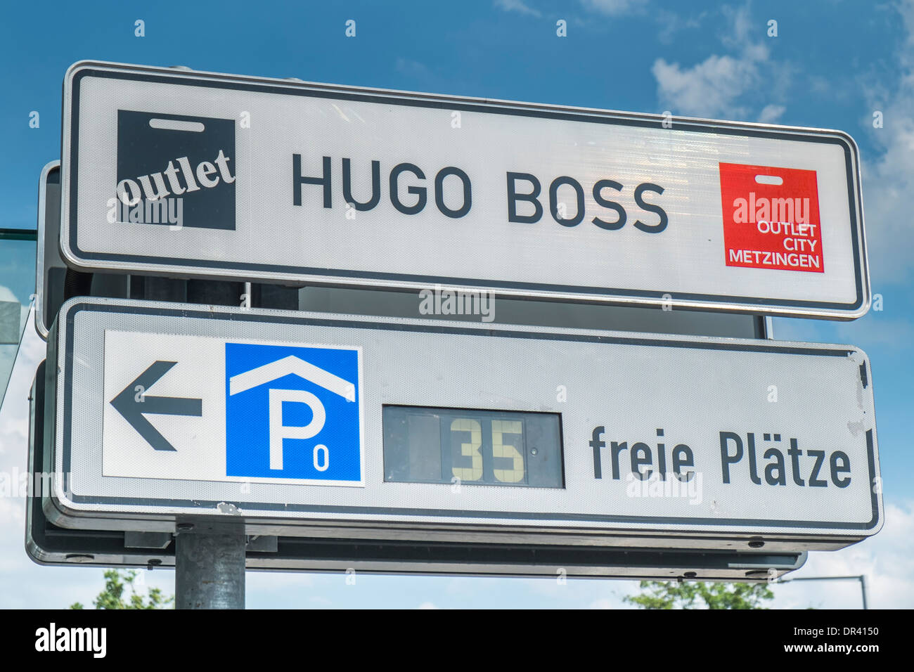 signpost parking space and the hugo boss on the premises of the outlet city, metzingen Stock Photo - Alamy