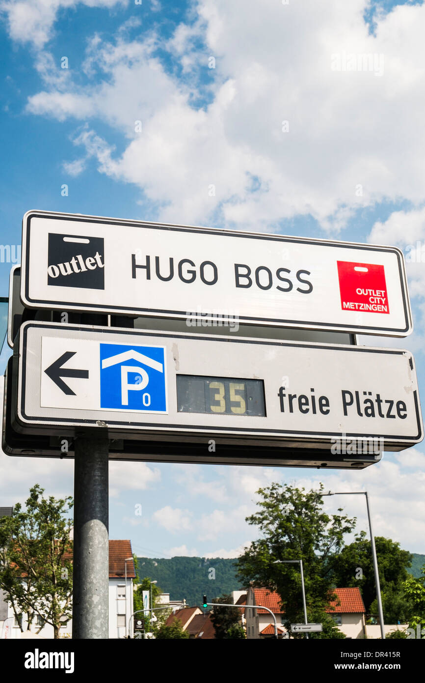 signpost indicating parking space and the hugo boss outlet on the premises  of the mwtzingen outlet city, metzingen Stock Photo - Alamy
