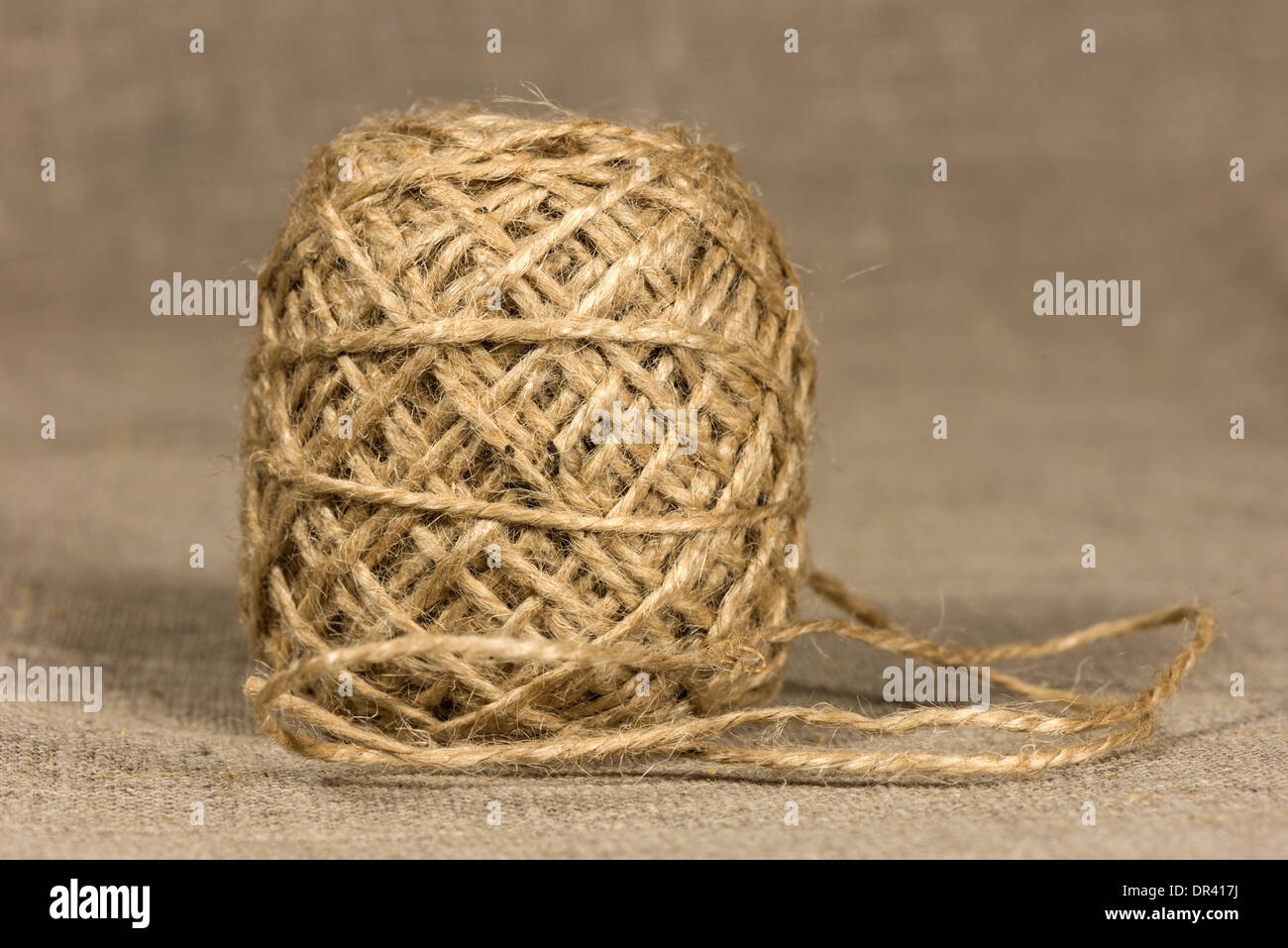 jute yarn coiling into a ball on the cloth Stock Photo