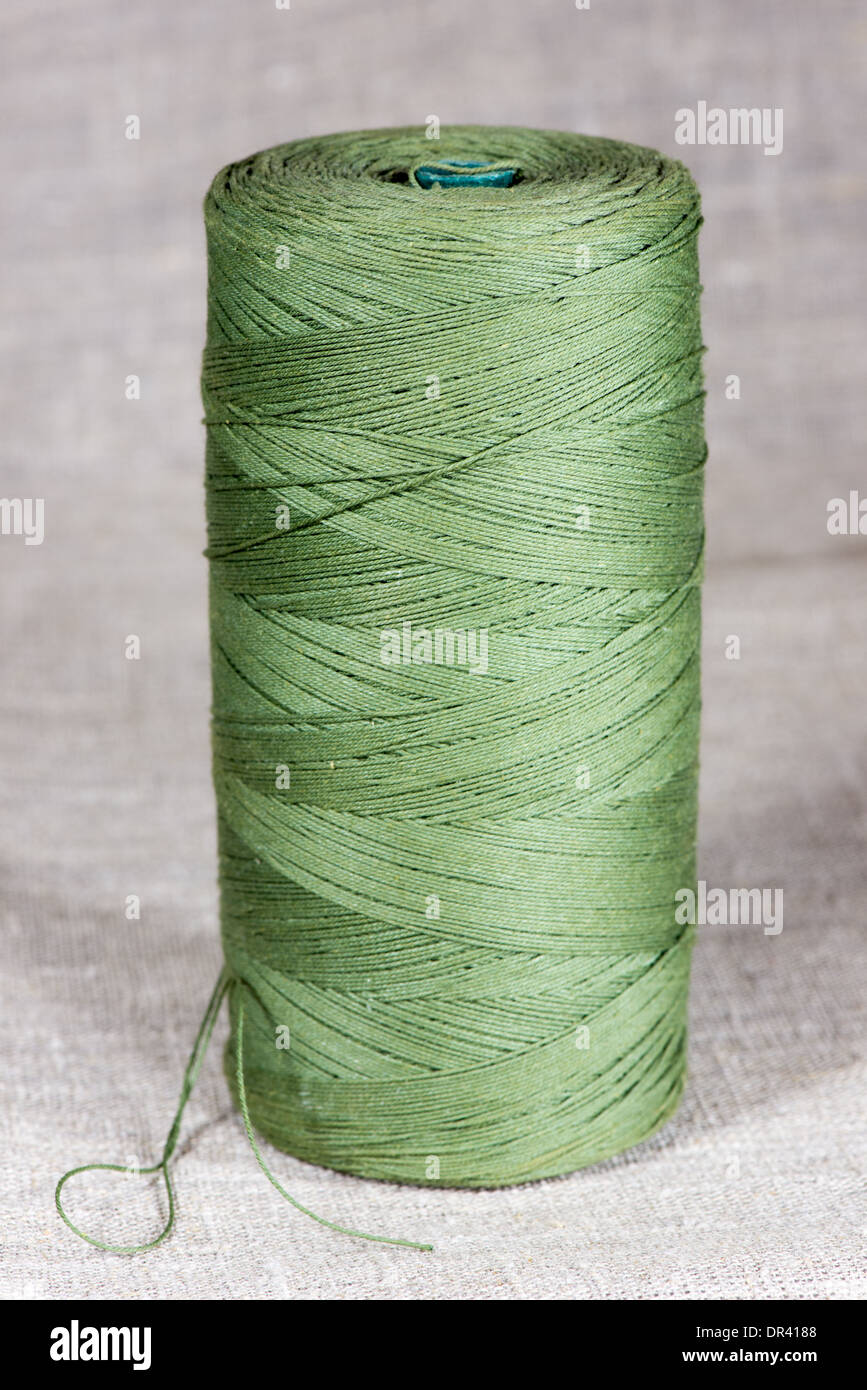 sturdy natural green thread on linseed canvas Stock Photo