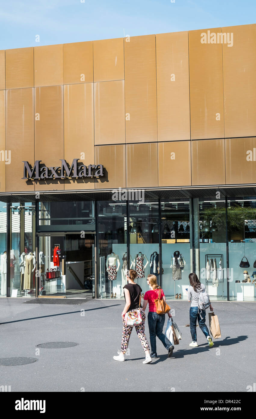 three female shoppers in front of the max mara outlet store, outlet city,  metzingen, baden-wuerttemberg, germany Stock Photo - Alamy