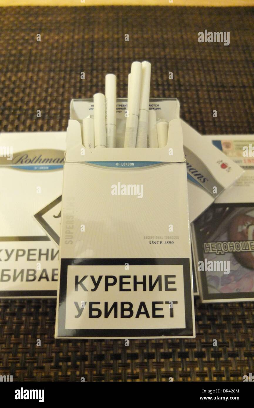 Kaliningrad, Russia 19th, January 2014  The EU's eastern border is the place of choice for cigarette smugglers, who can make easy profits from the price differences with Russia. A pack of premium cigarettes costs â‚¬5 in Belgium, â‚¬3 in Poland, and less than â‚¬1 in in Russia. Pictured: Rothmans cigrettes with Russian tax stamps. Stock Photo