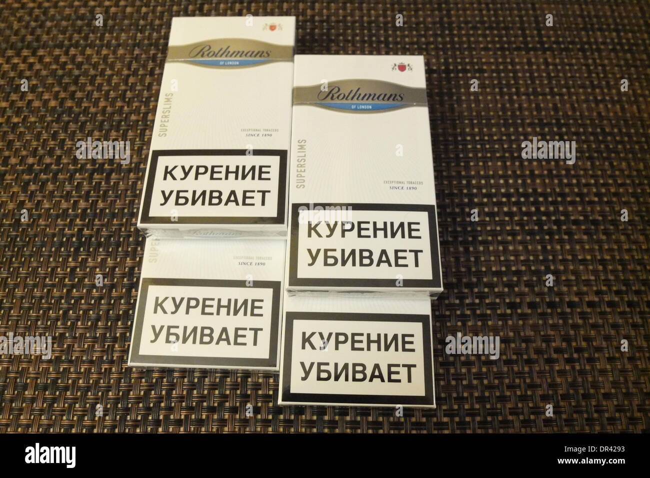 Kaliningrad, Russia 19th, January 2014  The EU's eastern border is the place of choice for cigarette smugglers, who can make easy profits from the price differences with Russia. A pack of premium cigarettes costs â‚¬5 in Belgium, â‚¬3 in Poland, and less than â‚¬1 in in Russia. Pictured: Rothmans cigrettes with Russian tax stamps. Stock Photo