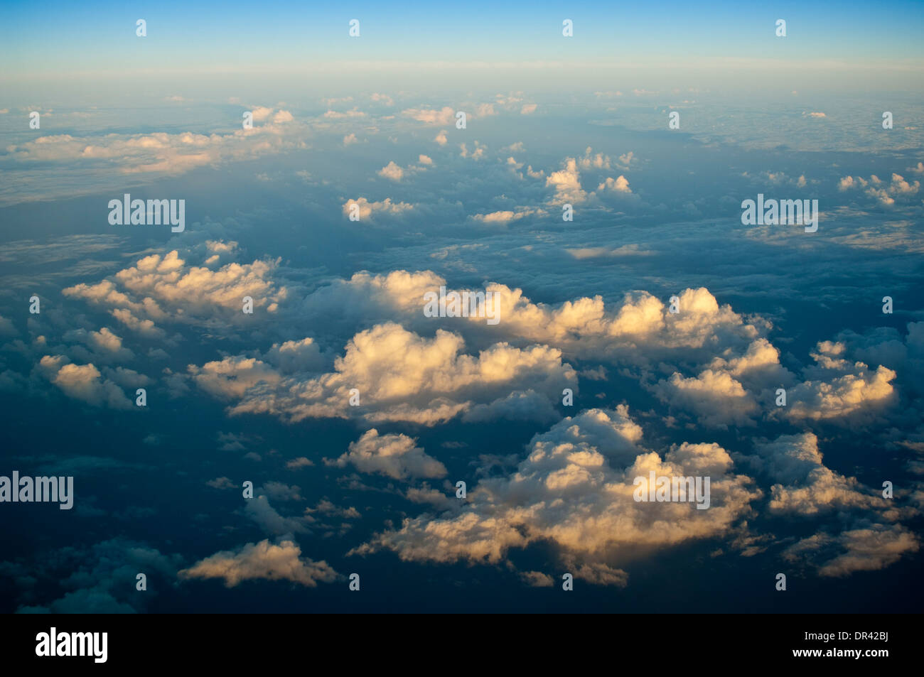 Cumulus clouds over the Pacific Ocean at sunset Stock Photo