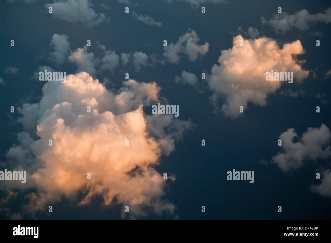 Cumulus clouds over the Pacific Ocean at sunset Stock Photo