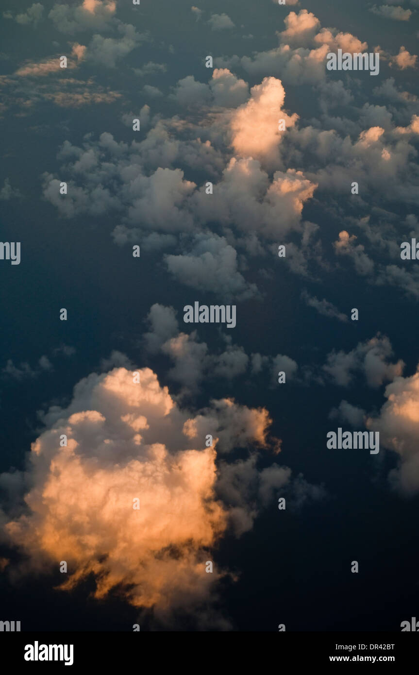 Cumulus clouds over the Pacific Ocean at sunset Stock Photo