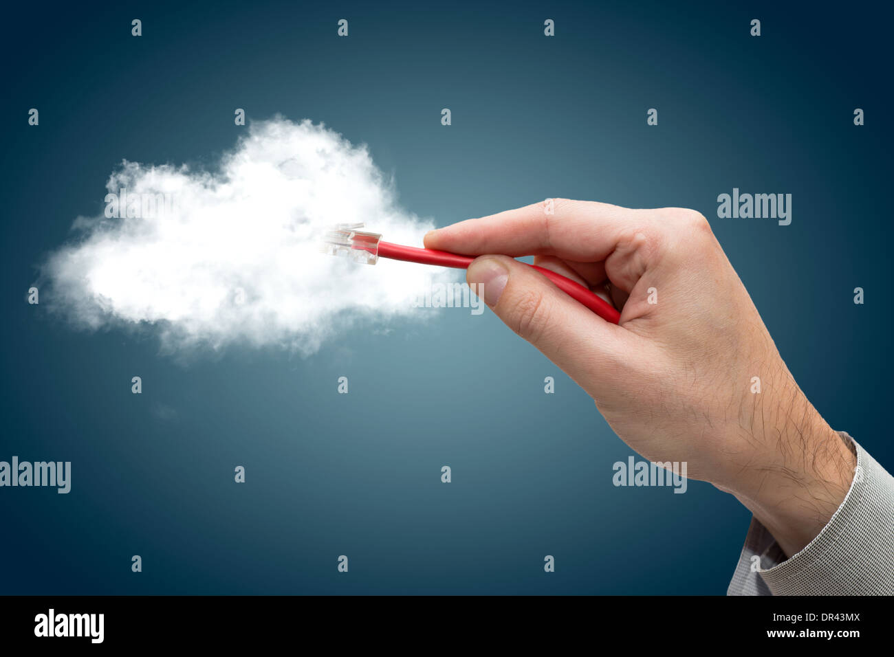Cloud computing concept. Hand with ethernet cable connecting into cloud. Stock Photo