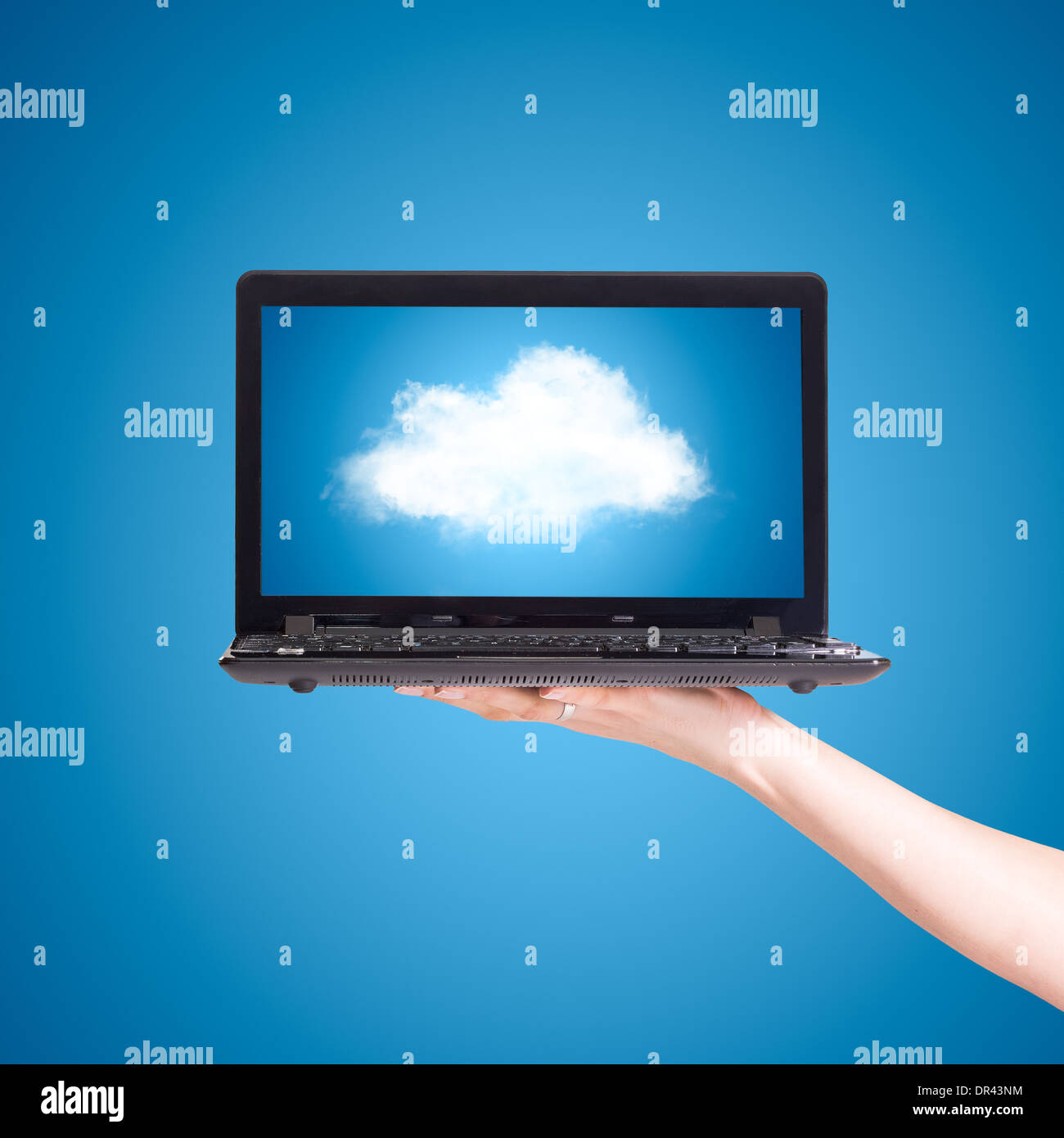 Picture of cloud from laptop screen under blue sky Stock Photo