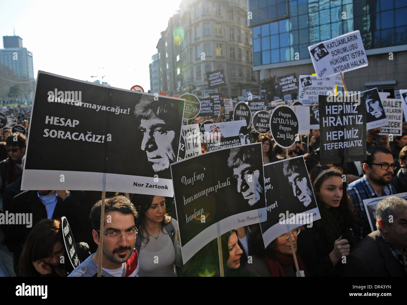 Istanbul. 19th Jan, 2014. Demonstrators take the street during a rally in Istanbul on Jan. 19, 2014. Tens of thousands gathered in Istanbul to mark the seventh anniversary of the killing of Turkish-Armenian journalist Hrant Dink. Dink, the former editor-in-chief of weekly Agos, was shot dead in front of his newspaper building by a 17-year-old nationalist in 2007. Credit:  Lu Zhe/Xinhua/Alamy Live News Stock Photo