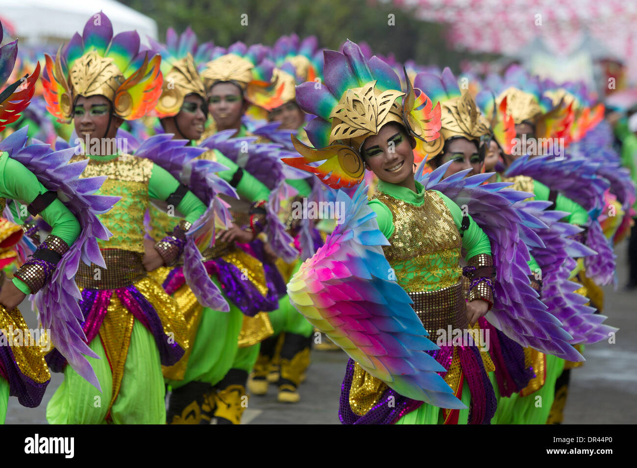 Cebu City,Philippines 19th Jan, 2014.  The nine day Catholic religious festival of Sinulog culminates on the third Sunday of January each year in one of the largest street dancing parades in the Philippines.The festival celebrates the Catholic belief of the holy Child Jesus 'Santo Nino' Credit:  imagegallery2/Alamy Live News Stock Photo
