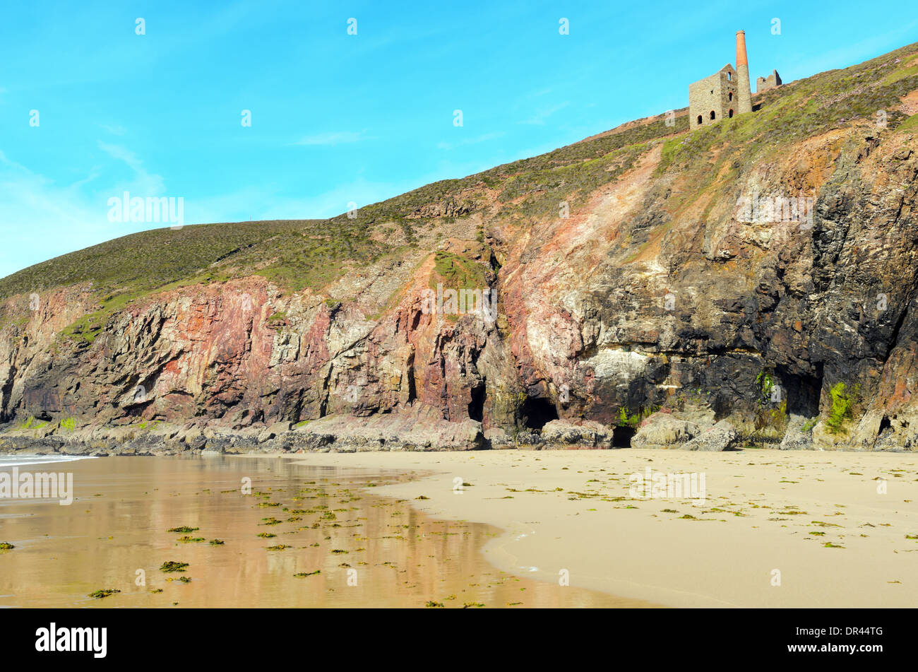 Chapel Porth beach and cliffs at low tide near St Agnes in Cornwall England Stock Photo