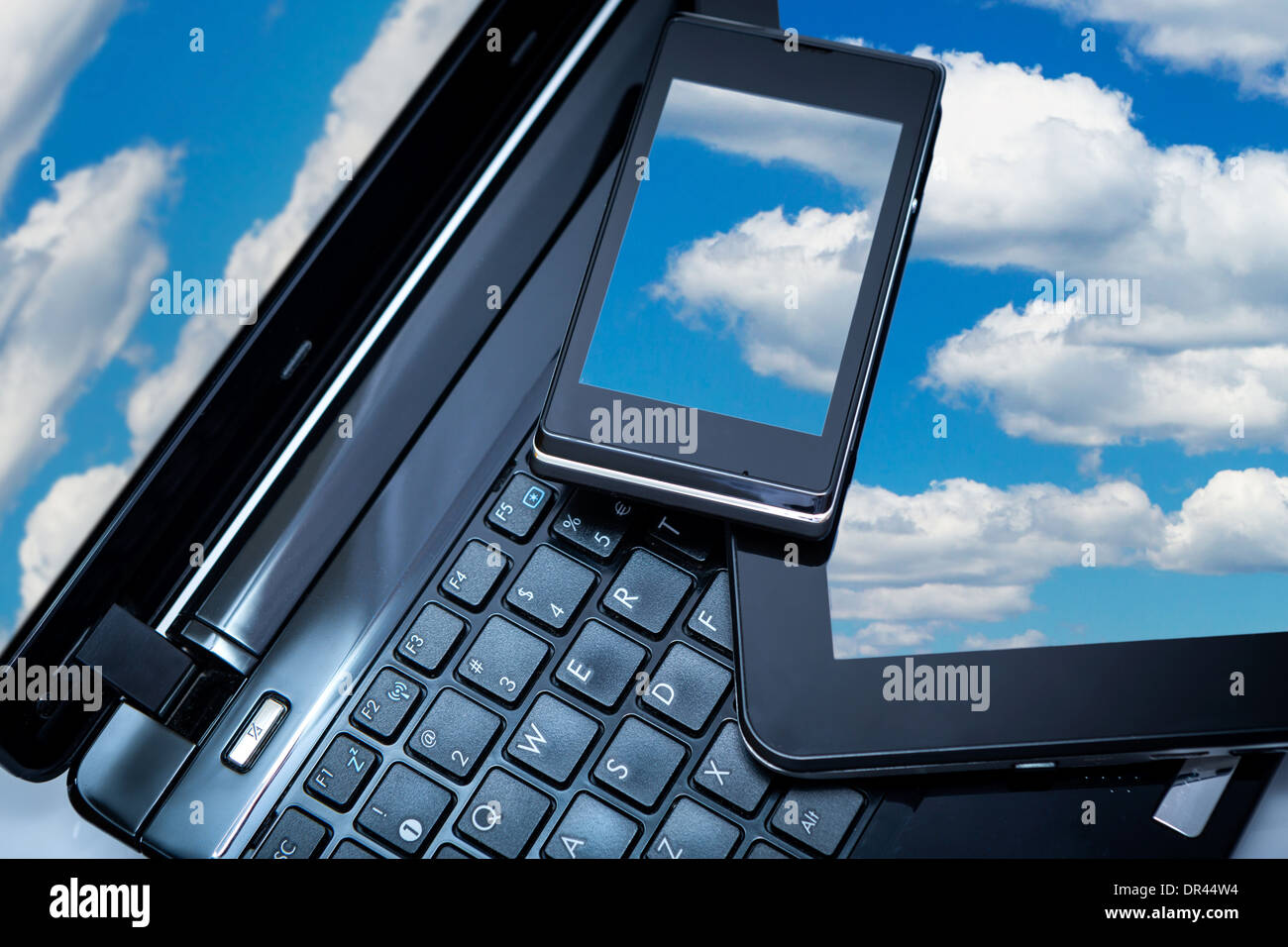 Cloud computing connection on digital tablet pc and modern smart phone. Stock Photo