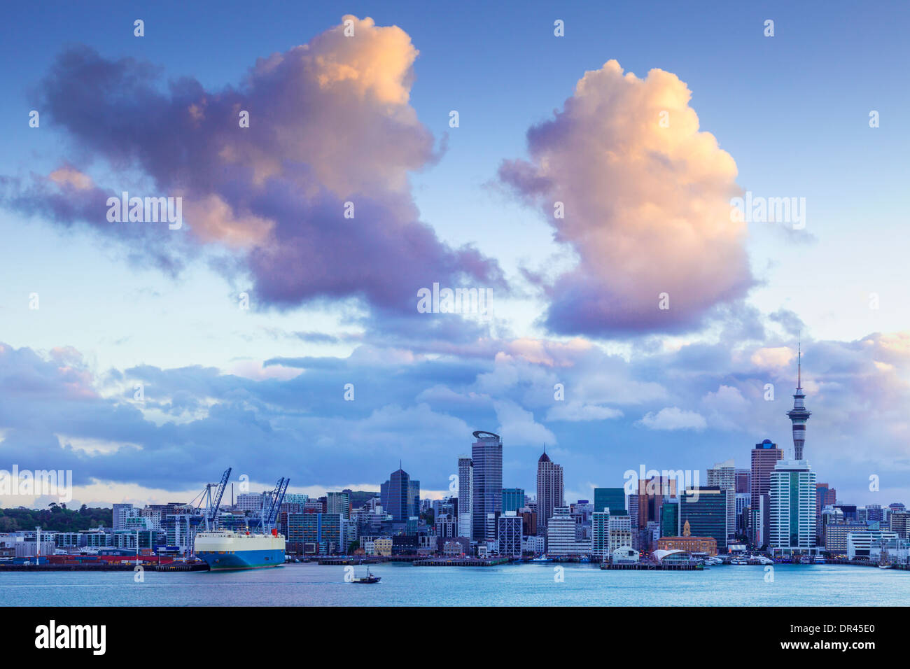 Auckland Skyline at twilight, with dramatic sunlit clouds. Stock Photo