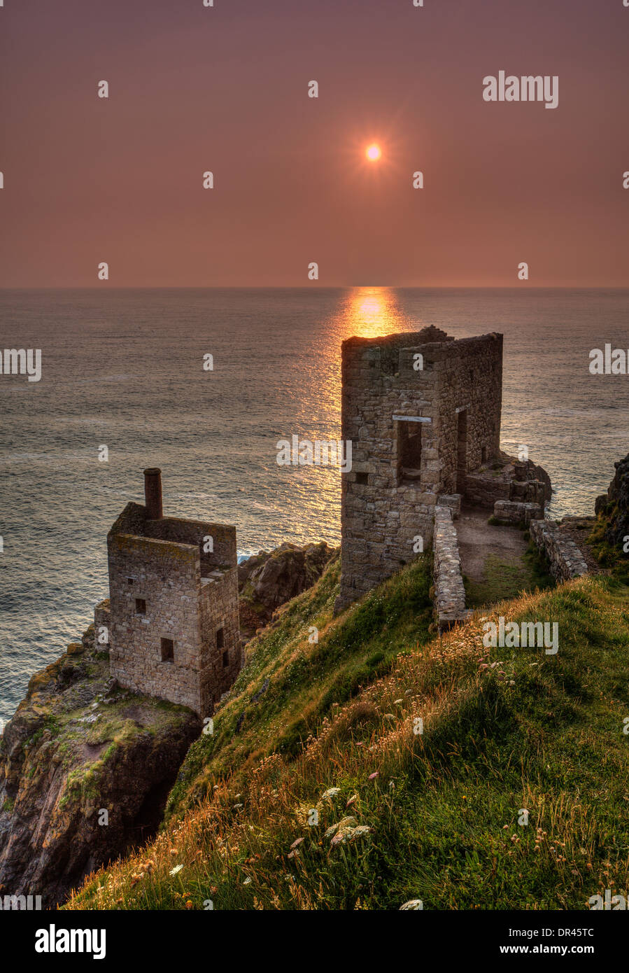 Ruin of the Crown Mine in the cliffs at Botallack, Cornwall, England, at sunset Stock Photo