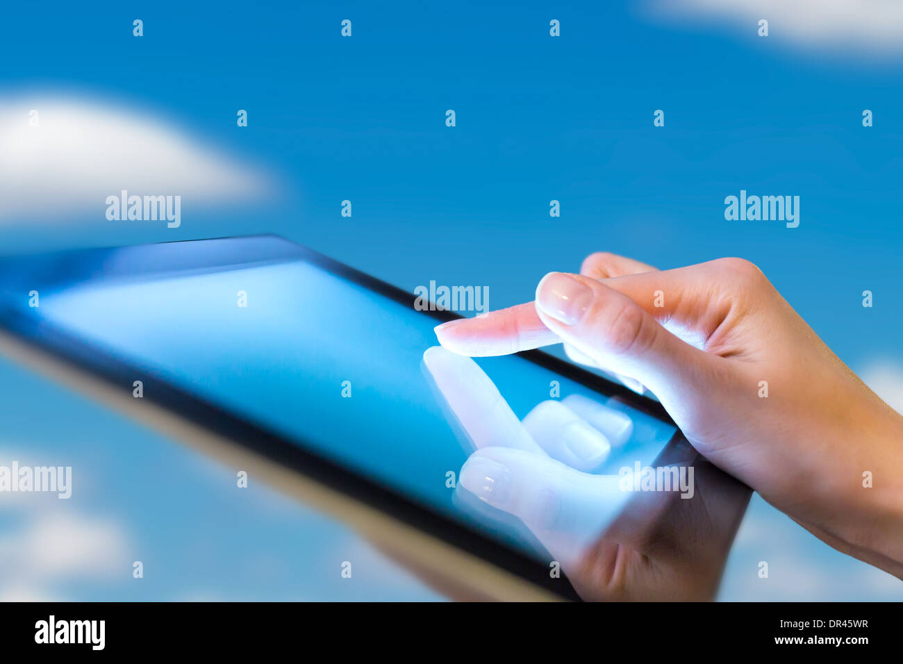 hand presses on screen digital tablet Stock Photo