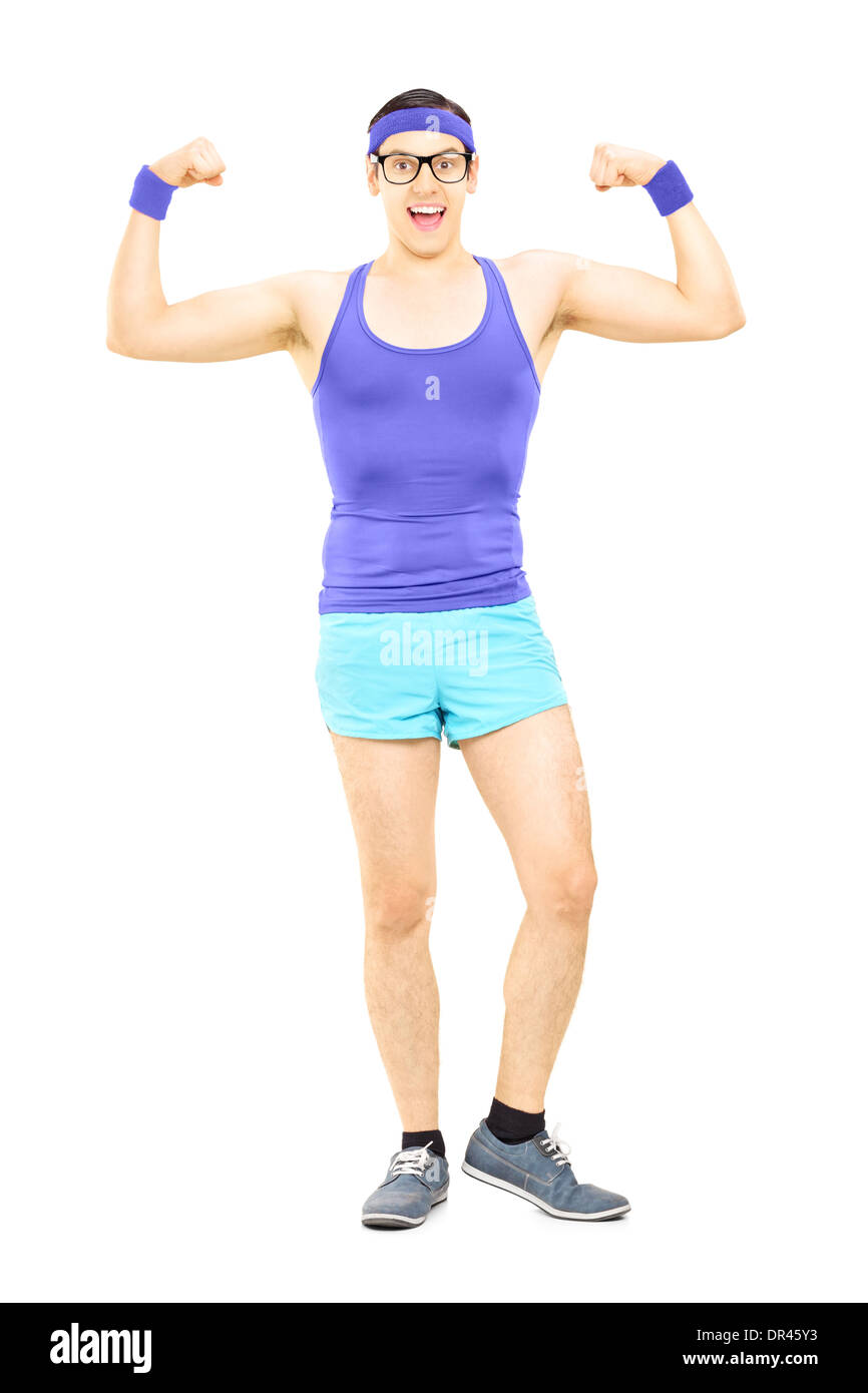 Full length portrait of a nerdy guy in sportswear showing muscles Stock Photo