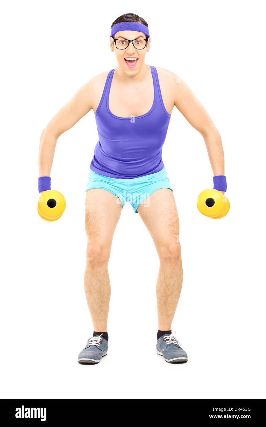 Nerdy guy exercising with dumbbells Stock Photo