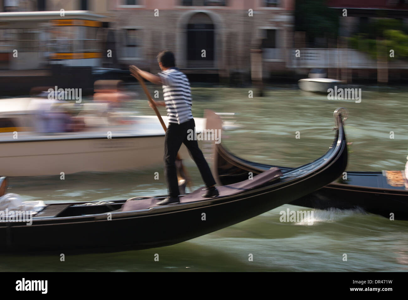 gondolier on Grand Canal in Venice, Italy Stock Photo