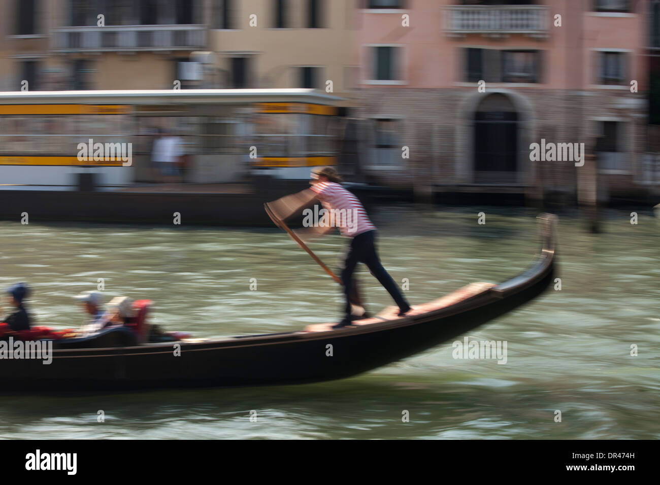 gondolier on Grand Canal in Venice, Italy Stock Photo