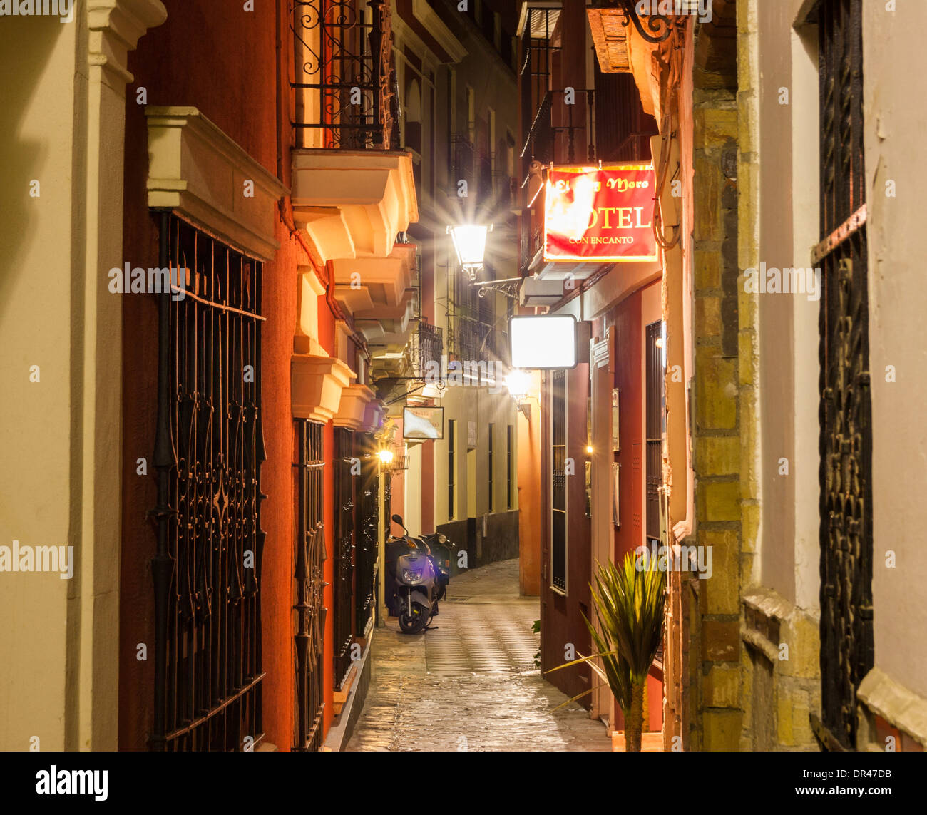 Narrow street in barrio Santa Cruz in Seville, Andalusia, Spain Stock Photo