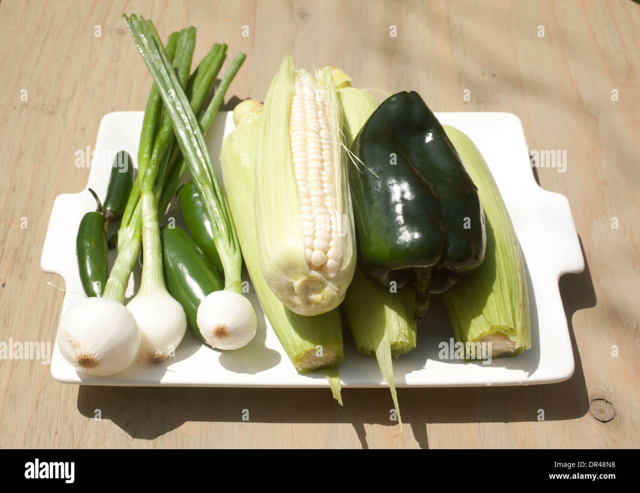 Raw vegetables on white plate Stock Photo