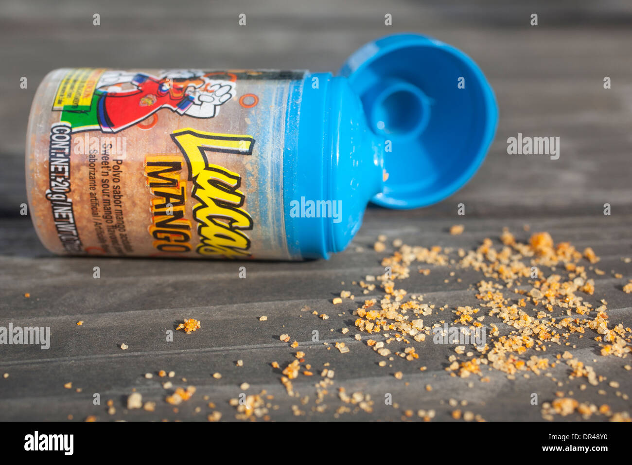 Lucas mango mexican candy powder spilled on table Stock Photo