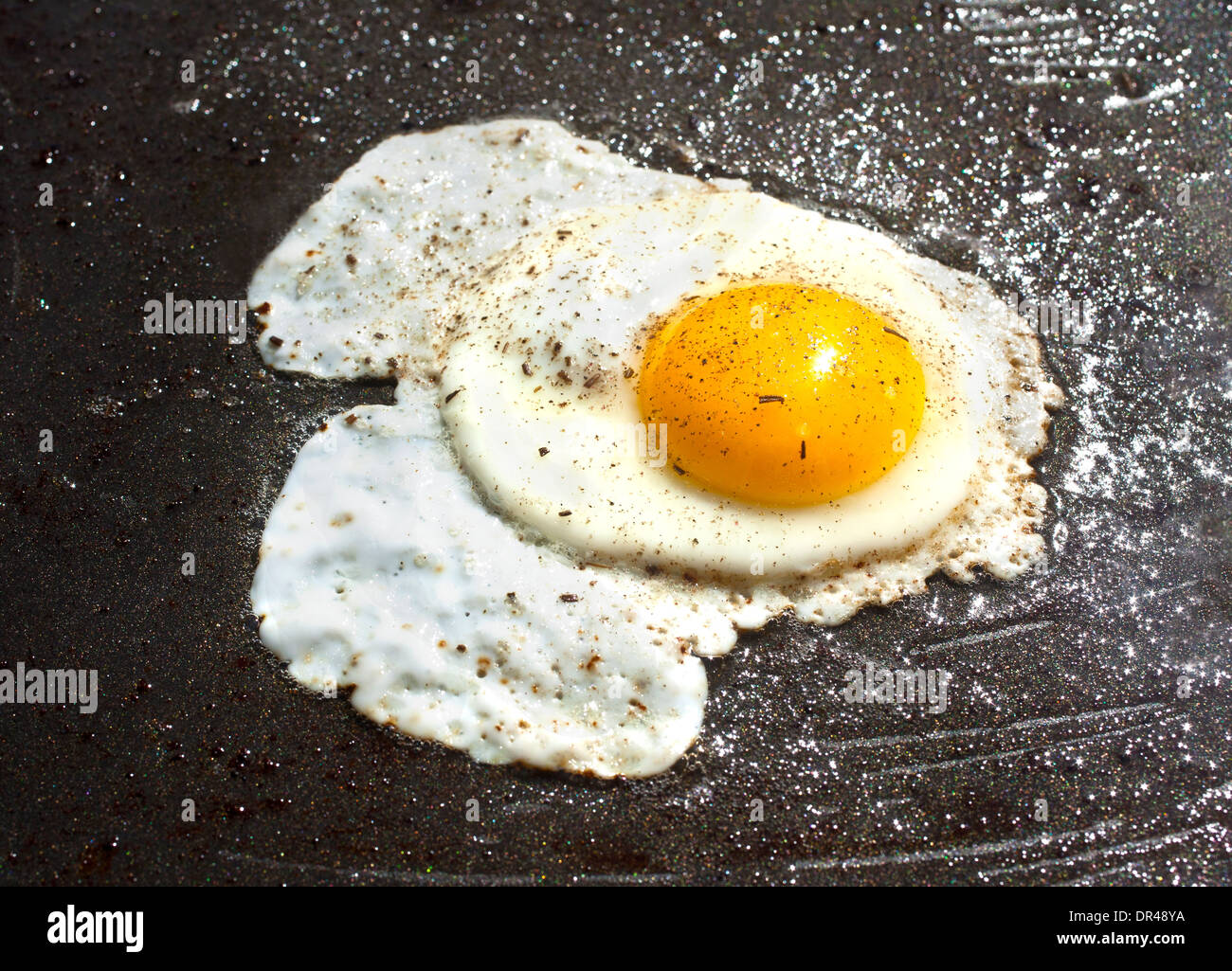 Fried egg outside on a skillet Stock Photo