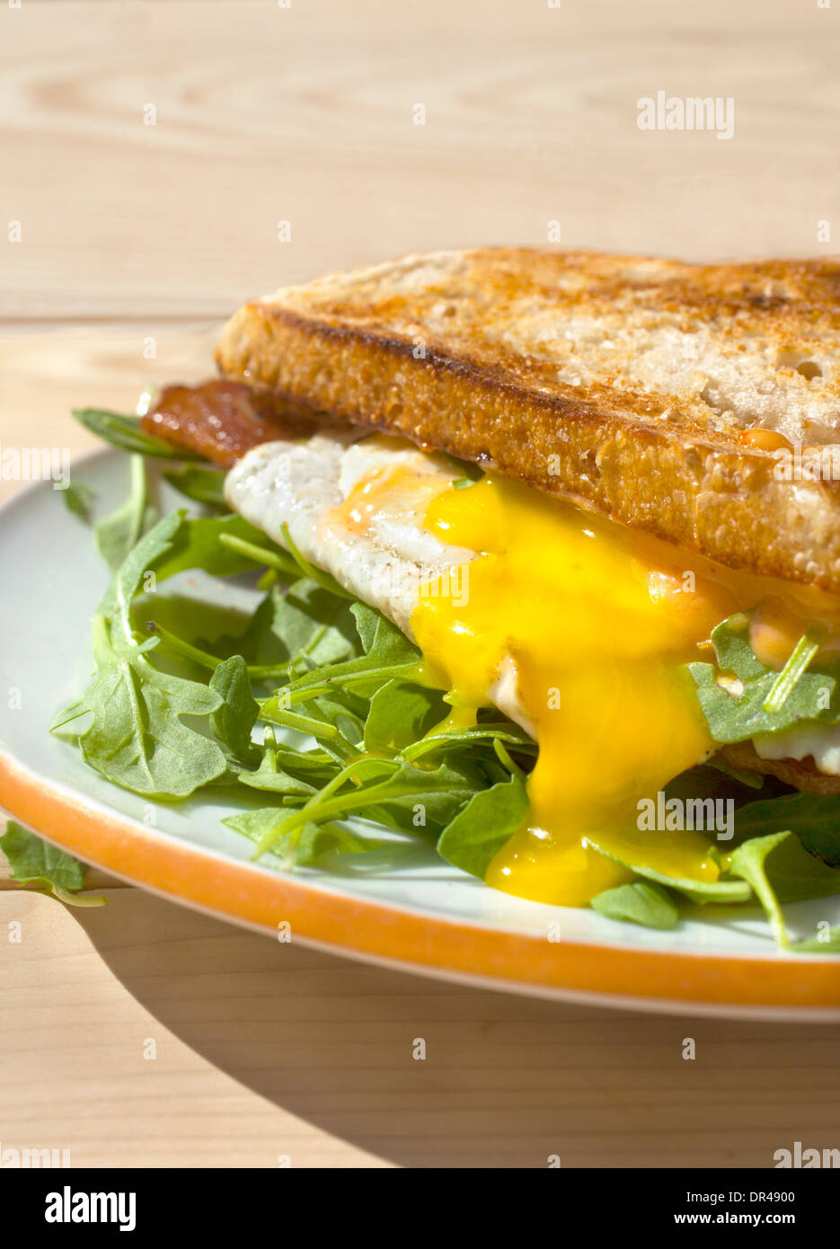 Runny egg breakfast sandwich Stock Photo
