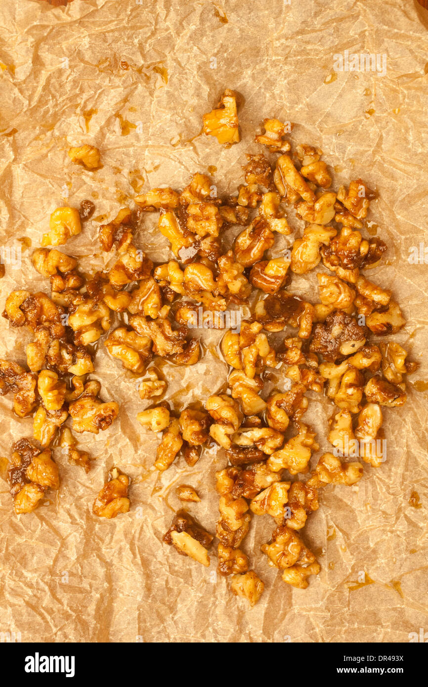 Roasted walnuts on parchment paper Stock Photo