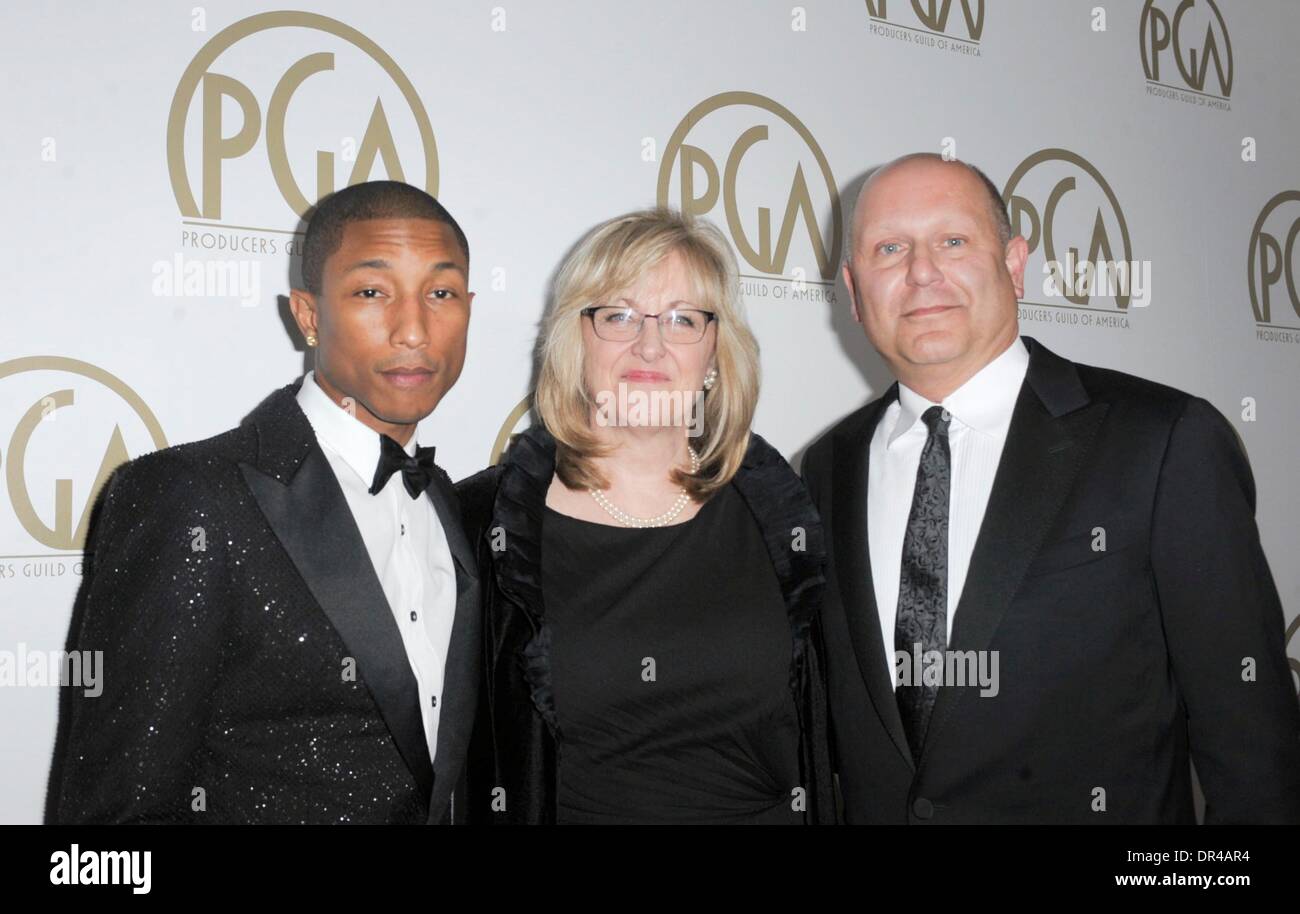 Beverly Hills, CA, . 19th Jan, 2014. Pharrell Williams, Janet Healy, Christopher Meledandri at arrivals for 25th Annual Producers Guild of America Awards (PGAs) - Arrivals, The Beverly Hilton Hotel, Beverly Hills, CA January 19, 2014. Credit:  Elizabeth Goodenough/Everett Collection/Alamy Live News Stock Photo