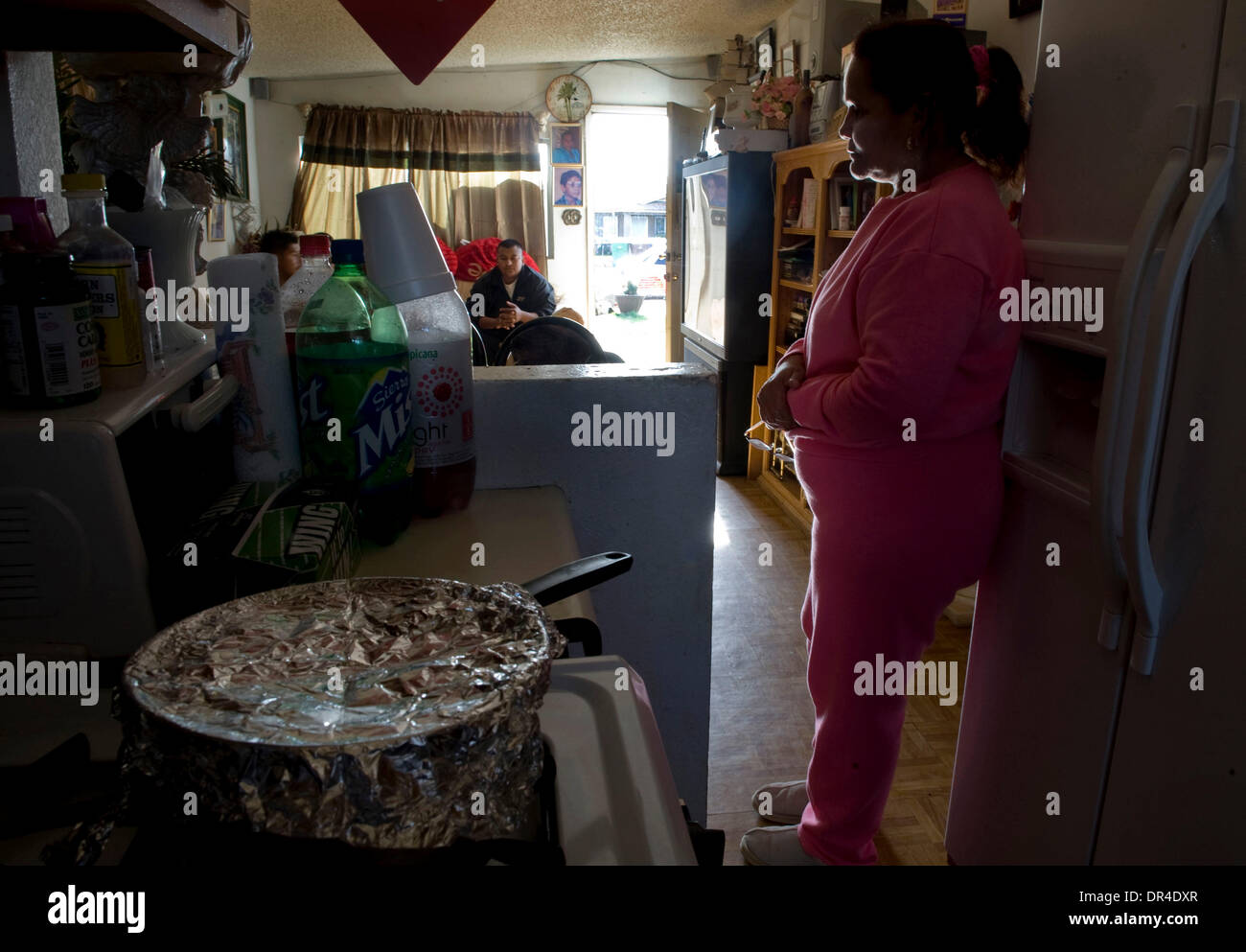 Feb 18, 2009 - Mendota, California, USA - MARIA AVILA, 56, said she boiled milk that would have gone bad to save it because she has run out of food and can't afford to waste anything. Farm workers who have been laid off due to the shortage of crops this year from lack of water are giving up their homes and worried about how they are going to eat and live. Story on the impact of wat Stock Photo