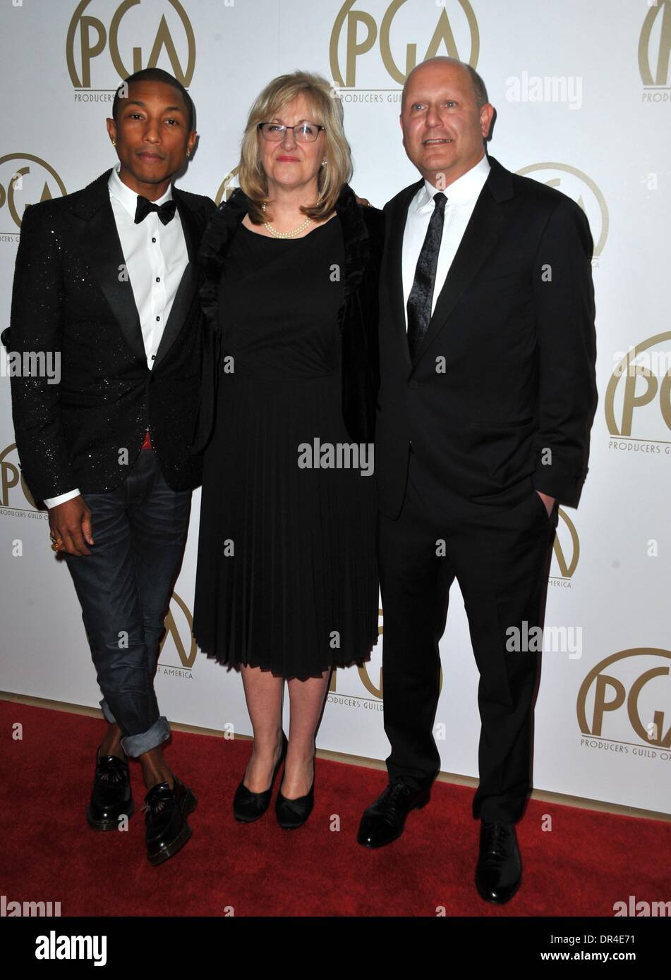 Beverly Hills, CA, . 19th Jan, 2014. Christopher Meledandri, Pharrell Williams, Janet Healy at arrivals for 25th Annual Producers Guild of America Awards (PGAs) - Arrivals, The Beverly Hilton Hotel, Beverly Hills, CA January 19, 2014. Credit:  Dee Cercone/Everett Collection/Alamy Live News Stock Photo
