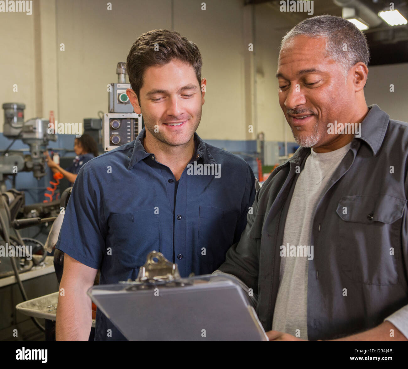Workers talking in warehouse Stock Photo