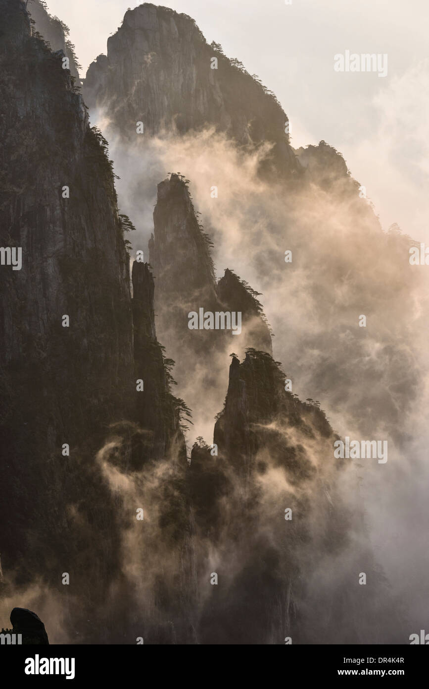 Fog rolling over mountains, Huangshan, Anhui, China, Stock Photo