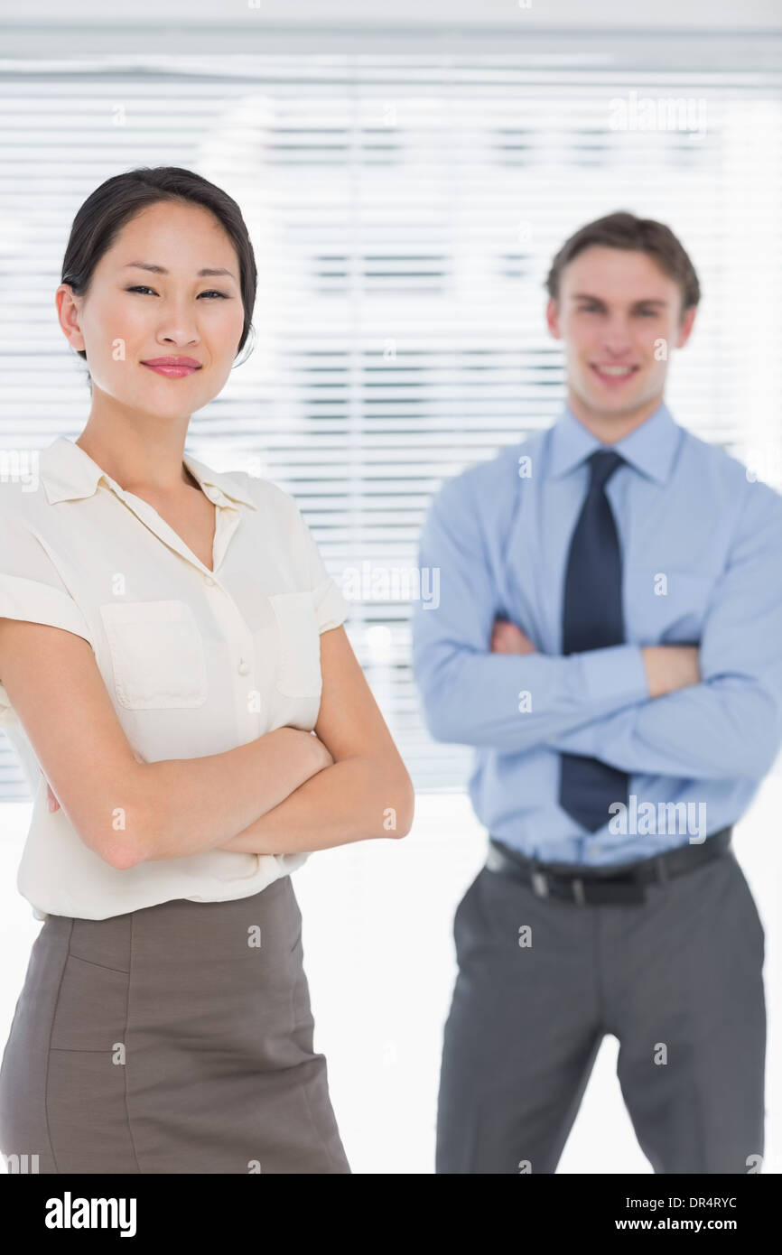Business colleagues with arms crossed in office Stock Photo - Alamy