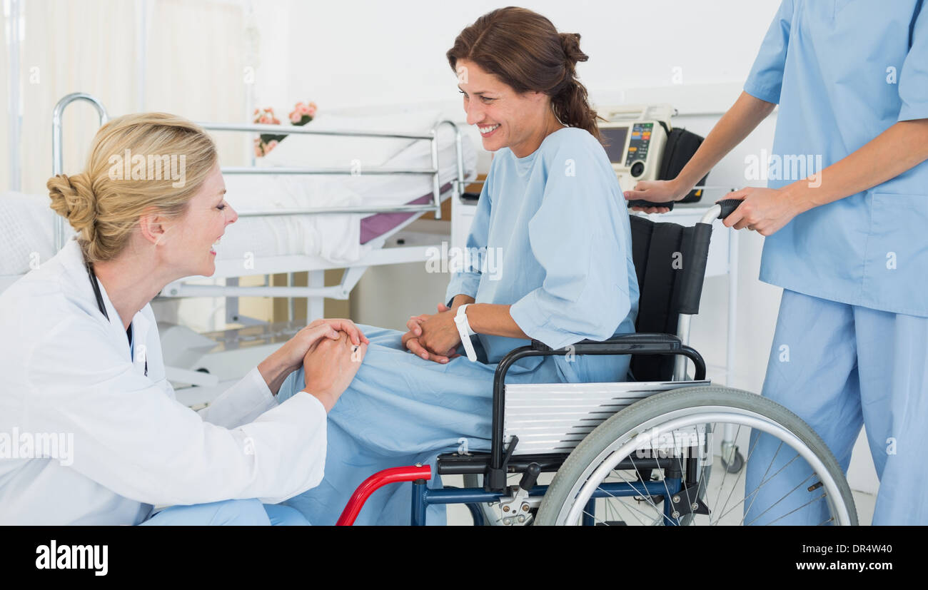 Doctor talking to patient in wheelchair at hospital Stock Photo Alamy