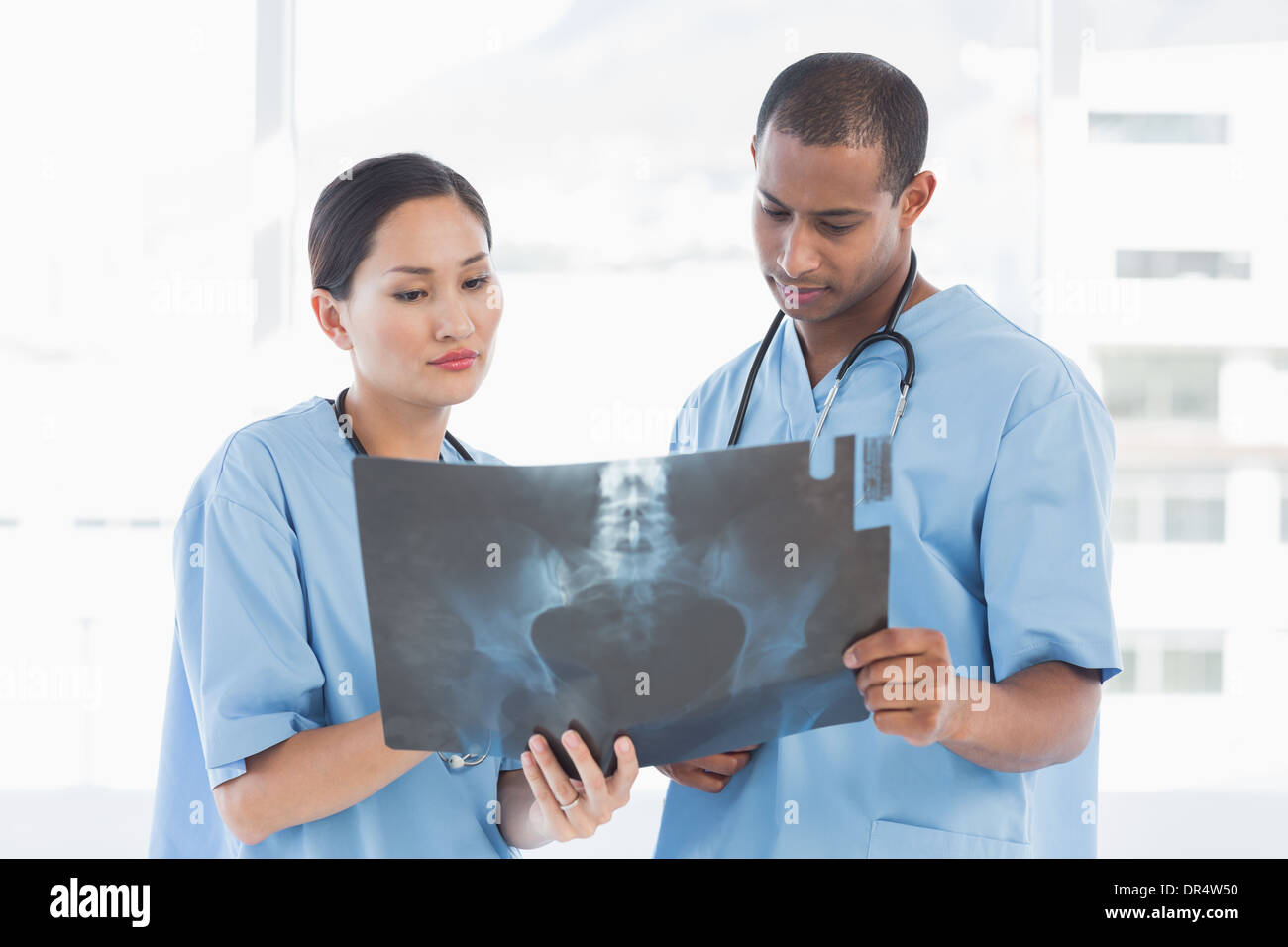 Asian doctor examining ray hi-res stock photography and images - Alamy