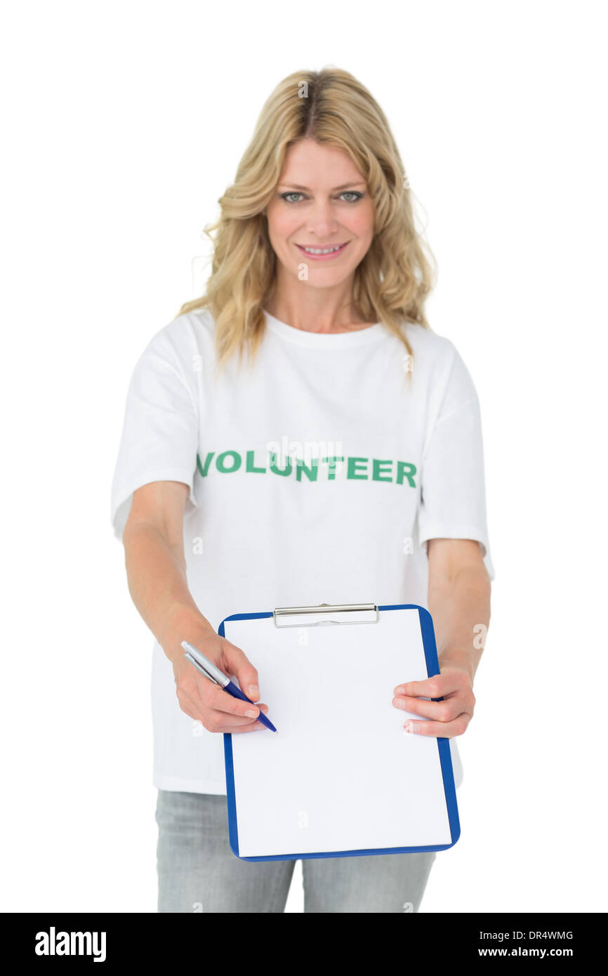 Portrait of a smiling young female volunteer holding clipboard Stock ...