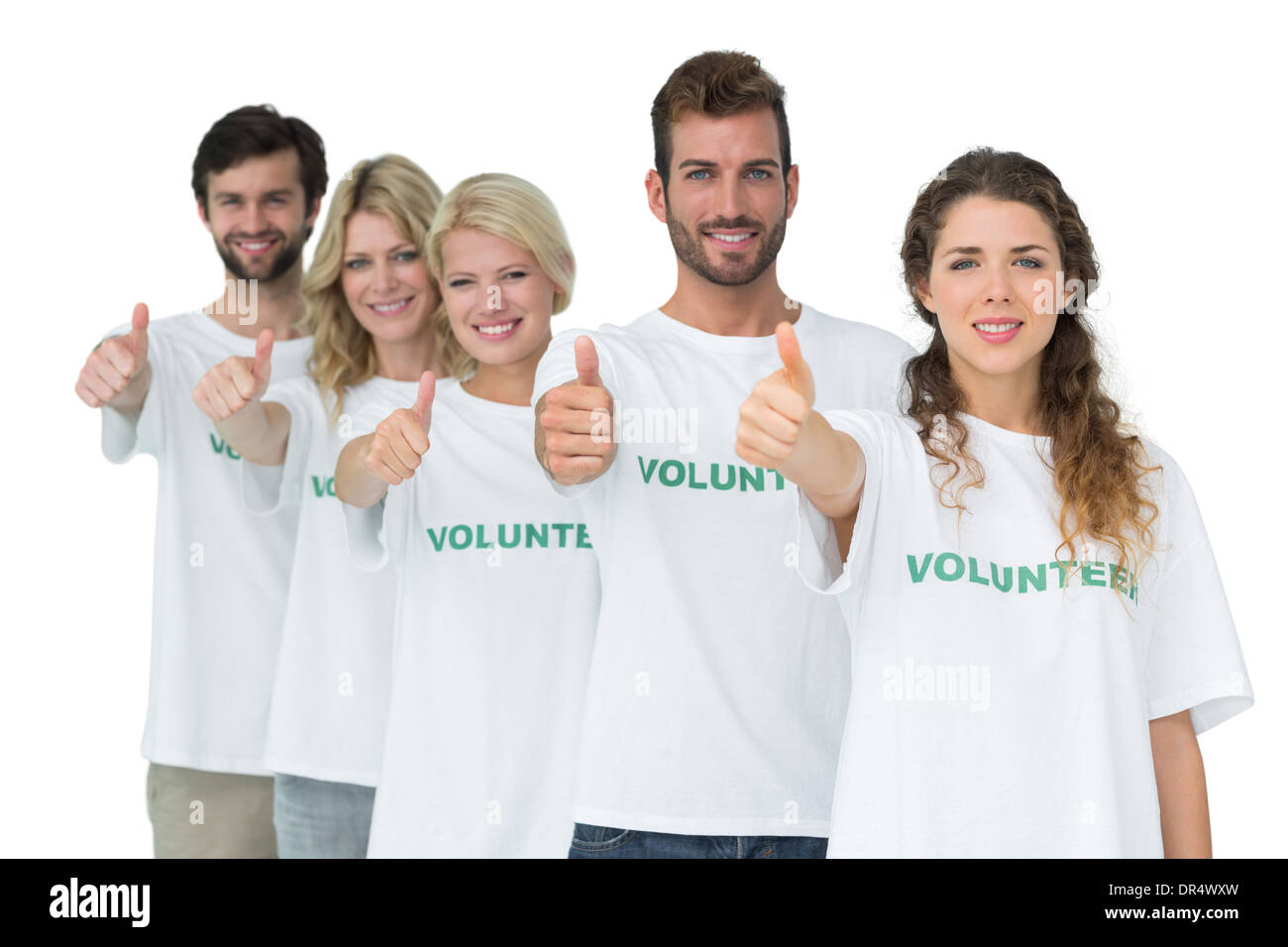 Group portrait of happy volunteers gesturing thumbs up Stock Photo - Alamy