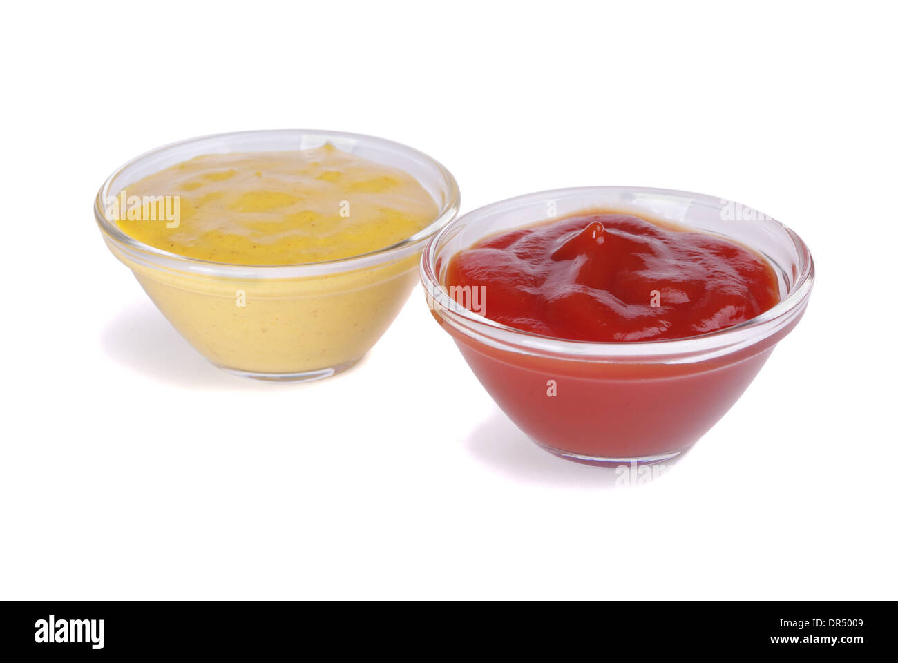 Ketchup and curry in bowl on a white background Stock Photo