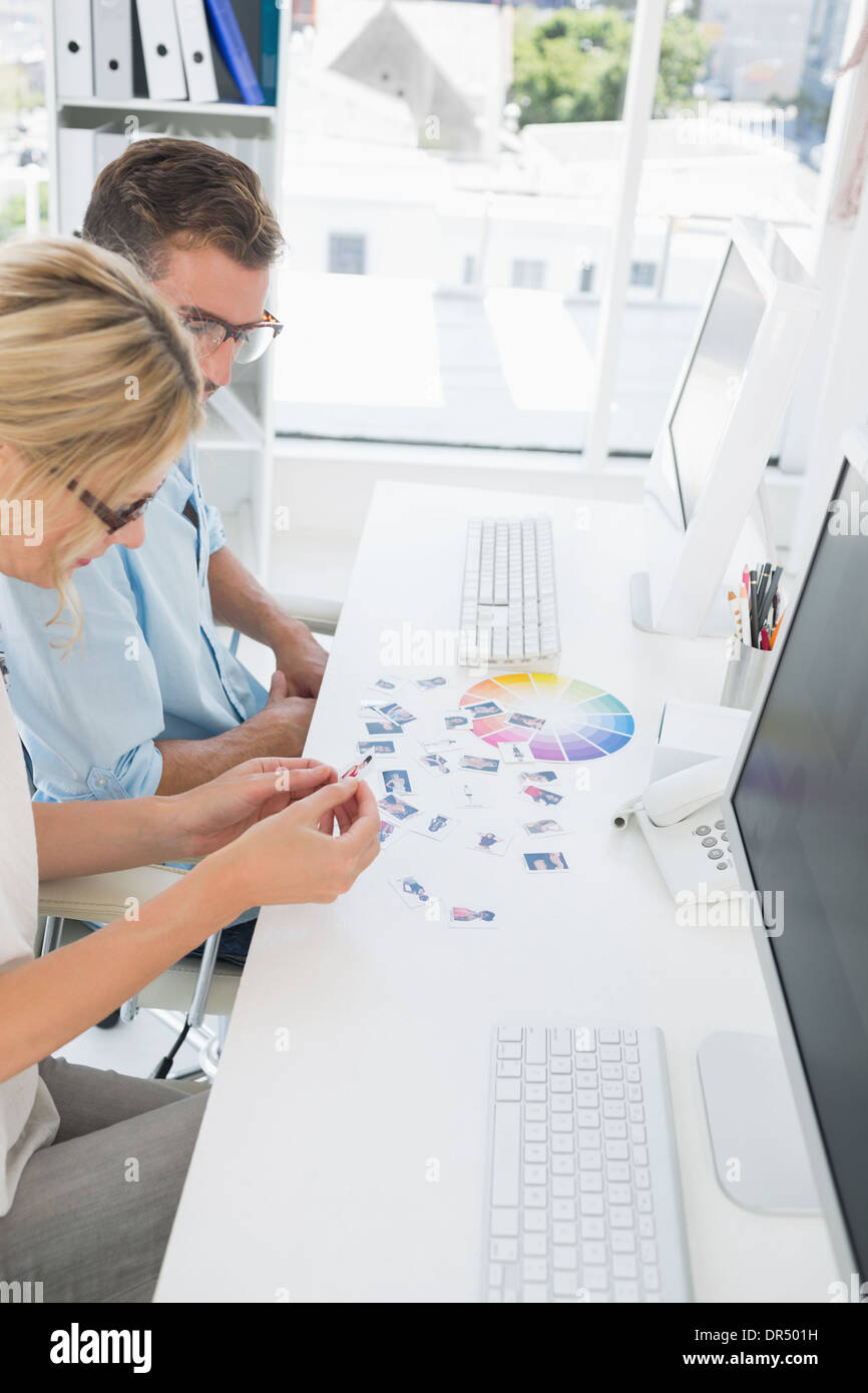 Casual photo editors working on computers Stock Photo