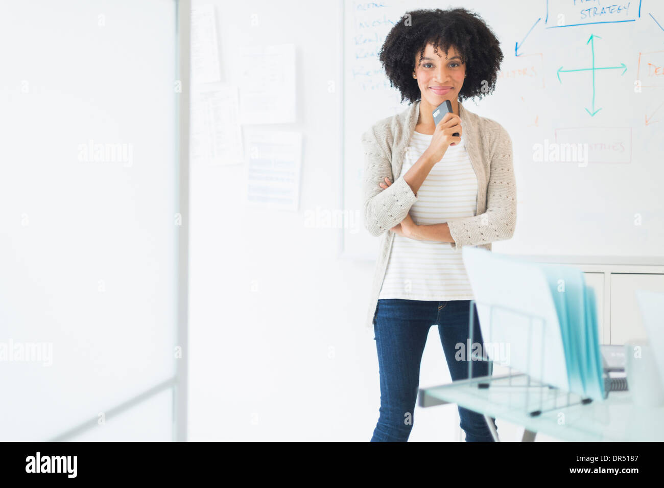 African American businesswoman smiling in office Stock Photo - Alamy