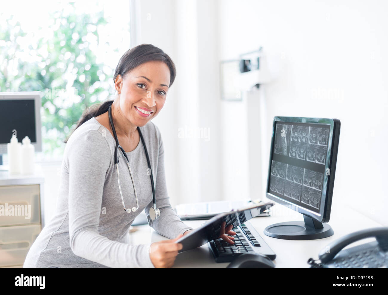 African american doctor holding hi-res stock photography and images - Alamy