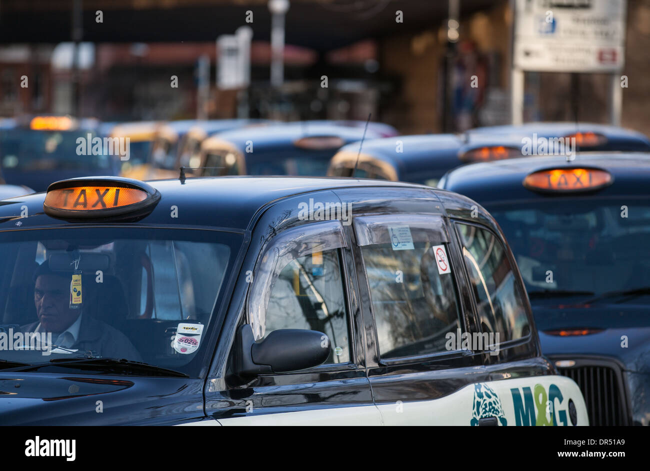 Hackney Cabs, Taxicab (hackney carriage), TX4  Private, Hire Vehicles for hire  Taxis in Manchester City Centre, Lancashire, UK Stock Photo