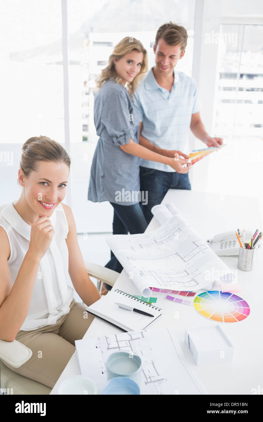 Group of artists working on designs Stock Photo Alamy